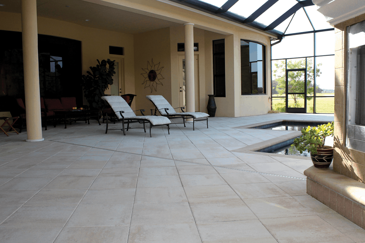 A pool deck of pavers in a client's backyard